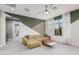 Bright living room with designer paint, plush carpet, modern furniture, and lots of natural light at 1936 W Kinfield Trl, Phoenix, AZ 85085