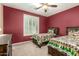 Cozy bedroom with twin beds, shutters, and neutral carpet at 20515 N 271St Ave, Buckeye, AZ 85396