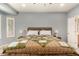 Inviting bedroom offers a king bed, a ceiling fan, and natural light from the windows at 20515 N 271St Ave, Buckeye, AZ 85396