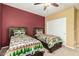 Bright bedroom featuring two twin beds with matching rustic wood frames and bear-themed bedding at 20515 N 271St Ave, Buckeye, AZ 85396