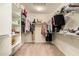 Walk-in closet with ample storage space, shelving, and carpeting at 20515 N 271St Ave, Buckeye, AZ 85396
