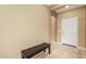 A welcoming entryway with a white front door, neutral walls, and tile flooring at 20515 N 271St Ave, Buckeye, AZ 85396
