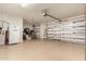 Spacious garage with coated floors, insulated walls, and plenty of storage space at 20515 N 271St Ave, Buckeye, AZ 85396