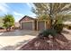 Two-car garage with well-maintained driveway and desert landscaping at 20515 N 271St Ave, Buckeye, AZ 85396