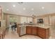 Kitchen features stainless dishwasher, granite countertops, and access to the dining and living areas at 20515 N 271St Ave, Buckeye, AZ 85396