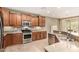 Spacious kitchen showcases granite countertops, stainless steel appliances, and wood cabinets at 20515 N 271St Ave, Buckeye, AZ 85396
