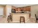Inviting kitchen showcases warm wood cabinetry, granite countertops, and stainless steel appliances at 20515 N 271St Ave, Buckeye, AZ 85396