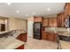 Open kitchen boasts granite countertops, stainless appliances, and tile flooring at 20515 N 271St Ave, Buckeye, AZ 85396