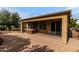 Inviting covered patio with brick pavers and a hot tub for relaxing outdoor enjoyment at 20515 N 271St Ave, Buckeye, AZ 85396