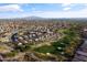 Aerial view of a residential community, showcasing the homes and a nearby golf course at 22419 W La Pasada Blvd, Buckeye, AZ 85326