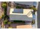 An aerial view of a well-maintained home featuring solar panels at 22419 W La Pasada Blvd, Buckeye, AZ 85326