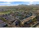 An aerial shot showcases a well-planned community with curved streets and meticulously landscaped yards at 22419 W La Pasada Blvd, Buckeye, AZ 85326