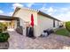 Backyard patio with BBQ, outdoor storage, and artificial turf at 22419 W La Pasada Blvd, Buckeye, AZ 85326