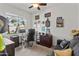 A functional bedroom that is currently staged as a home office with a window providing plenty of natural light at 22419 W La Pasada Blvd, Buckeye, AZ 85326