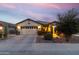 Beautiful single-story home featuring a well-manicured front yard and a two-car garage at 22419 W La Pasada Blvd, Buckeye, AZ 85326