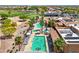 Aerial view of a community pool and lounge area surrounded by palm trees and manicured landscaping at 22419 W La Pasada Blvd, Buckeye, AZ 85326