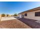 Spacious backyard with desert landscaping, basketball court, and storage shed at 22727 W Papago St, Buckeye, AZ 85326