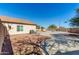 Large backyard with desert landscaping, privacy fence, and view of the refreshing pool at 22727 W Papago St, Buckeye, AZ 85326