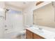 A well-lit bathroom features a vanity with a sink and a shower-tub combination for convenience at 22727 W Papago St, Buckeye, AZ 85326
