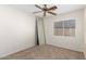 Bedroom with a window and ceiling fan that offers natural light and a comfortable atmosphere at 22727 W Papago St, Buckeye, AZ 85326