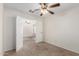 Bedroom with a ceiling fan and carpet that offers a comfortable and inviting space to relax at 22727 W Papago St, Buckeye, AZ 85326