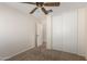 Bedroom with neutral walls, carpet, and a closet offers a clean and adaptable space for living at 22727 W Papago St, Buckeye, AZ 85326