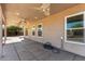 Covered patio features ceiling fans and views of backyard area at 22727 W Papago St, Buckeye, AZ 85326