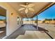 View of the covered patio with ceiling fans, overlooking backyard at 22727 W Papago St, Buckeye, AZ 85326