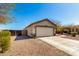 Single-Gathering home featuring a two-car garage and desert landscaping at 22727 W Papago St, Buckeye, AZ 85326