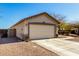 Single-Gathering home featuring a two-car garage and desert landscaping at 22727 W Papago St, Buckeye, AZ 85326