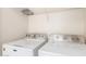 Close up on a washer and dryer shows modern appliances for a convenient laundry experience at 22727 W Papago St, Buckeye, AZ 85326