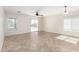Bright living room featuring tiled flooring and a glass slider at 22727 W Papago St, Buckeye, AZ 85326