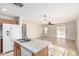 Kitchen island and combined living and dining area featuring tile flooring at 22727 W Papago St, Buckeye, AZ 85326