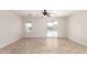 Bright living room featuring tiled flooring and a view of the outdoor pool at 22727 W Papago St, Buckeye, AZ 85326