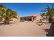 Spacious backyard with desert landscaping, a covered patio, and a sparkling pool perfect for outdoor living at 24832 S Boxwood Dr, Sun Lakes, AZ 85248