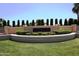 Elegant community entrance sign with manicured landscaping, creating a welcoming first impression at 24832 S Boxwood Dr, Sun Lakes, AZ 85248