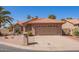 Charming single-story home features a neutral color palette, desert landscaping, and two-car garage at 24832 S Boxwood Dr, Sun Lakes, AZ 85248