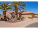 Beautiful Southwestern-style home showcasing desert landscaping, a cozy porch, and red tile roof at 24832 S Boxwood Dr, Sun Lakes, AZ 85248