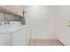 Laundry room featuring white washer and dryer with cabinets and tiled floor at 24832 S Boxwood Dr, Sun Lakes, AZ 85248