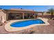 Beautiful in-ground pool and covered patio perfect for backyard entertaining at 24832 S Boxwood Dr, Sun Lakes, AZ 85248