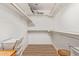 Spacious walk-in closet with built-in shelving and hanging rods for optimal storage at 24832 S Boxwood Dr, Sun Lakes, AZ 85248