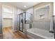 Bathroom with a separate shower and tub, complemented by modern fixtures and a window at 2517 W Balao Dr, Phoenix, AZ 85085