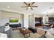 Comfortable living room featuring a ceiling fan and plush seating arrangement at 2517 W Balao Dr, Phoenix, AZ 85085