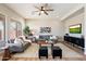 Comfortable living room featuring a ceiling fan and plush seating arrangement at 2517 W Balao Dr, Phoenix, AZ 85085