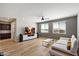 This open living room features hardwood floors, a modern sofa, and neutral walls for a bright, airy atmosphere at 2517 W Balao Dr, Phoenix, AZ 85085