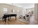 Open-concept living room showcasing ample natural light, a piano, and modern decor at 2517 W Balao Dr, Phoenix, AZ 85085