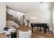 Spacious living room boasting wood flooring, staircase, and comfortable seating at 2517 W Balao Dr, Phoenix, AZ 85085