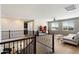 Bright living room featuring hardwood floors, a modern sofa, and windows with blinds providing natural light at 2517 W Balao Dr, Phoenix, AZ 85085