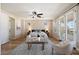 Spacious main bedroom retreat with a seating area, ceiling fan, and private balcony access at 2517 W Balao Dr, Phoenix, AZ 85085