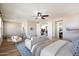 Expansive main bedroom suite featuring a seating area and neutral decor with connected ensuite at 2517 W Balao Dr, Phoenix, AZ 85085